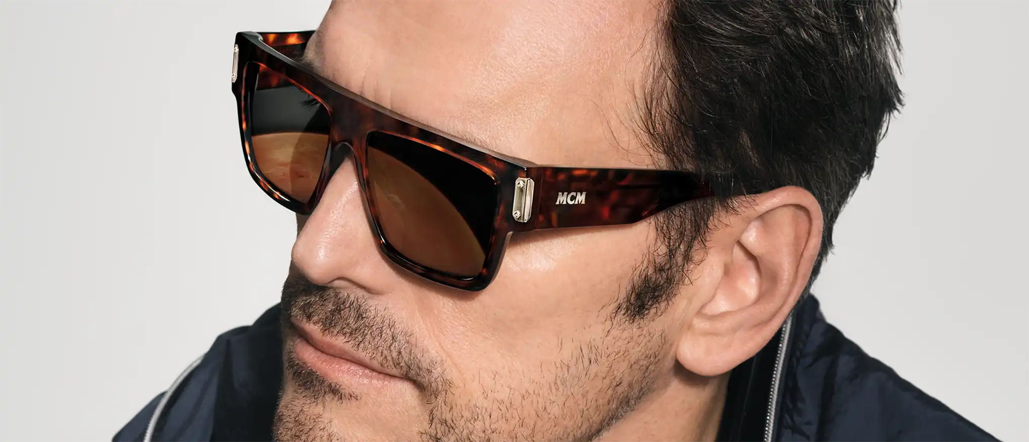 Man wearing MCM sunglasses